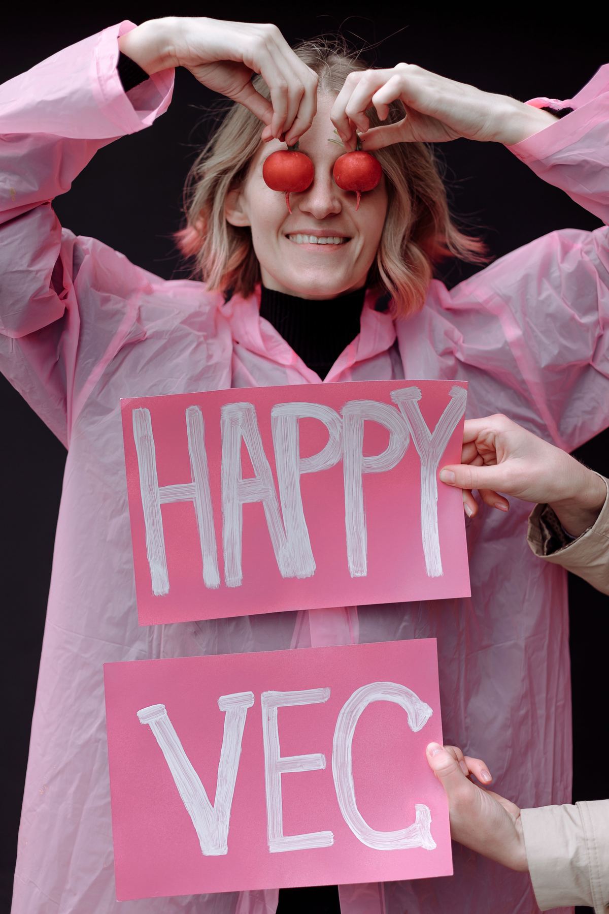 Illustrative stock photograph showing a person holding a handwritten sign celebrating a vegetarian lifestyle